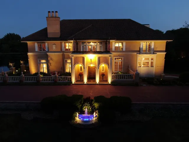 a view of an empty room with a fireplace and a window