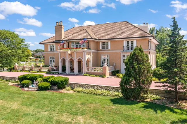 a view of a garden with a building in the background
