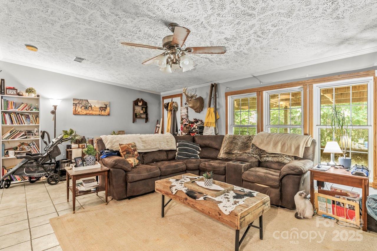 4155 Slanting Bridge Road Sherrills Ford, NC 28673 - Photo 20 of 34 a living room with furniture and a large window