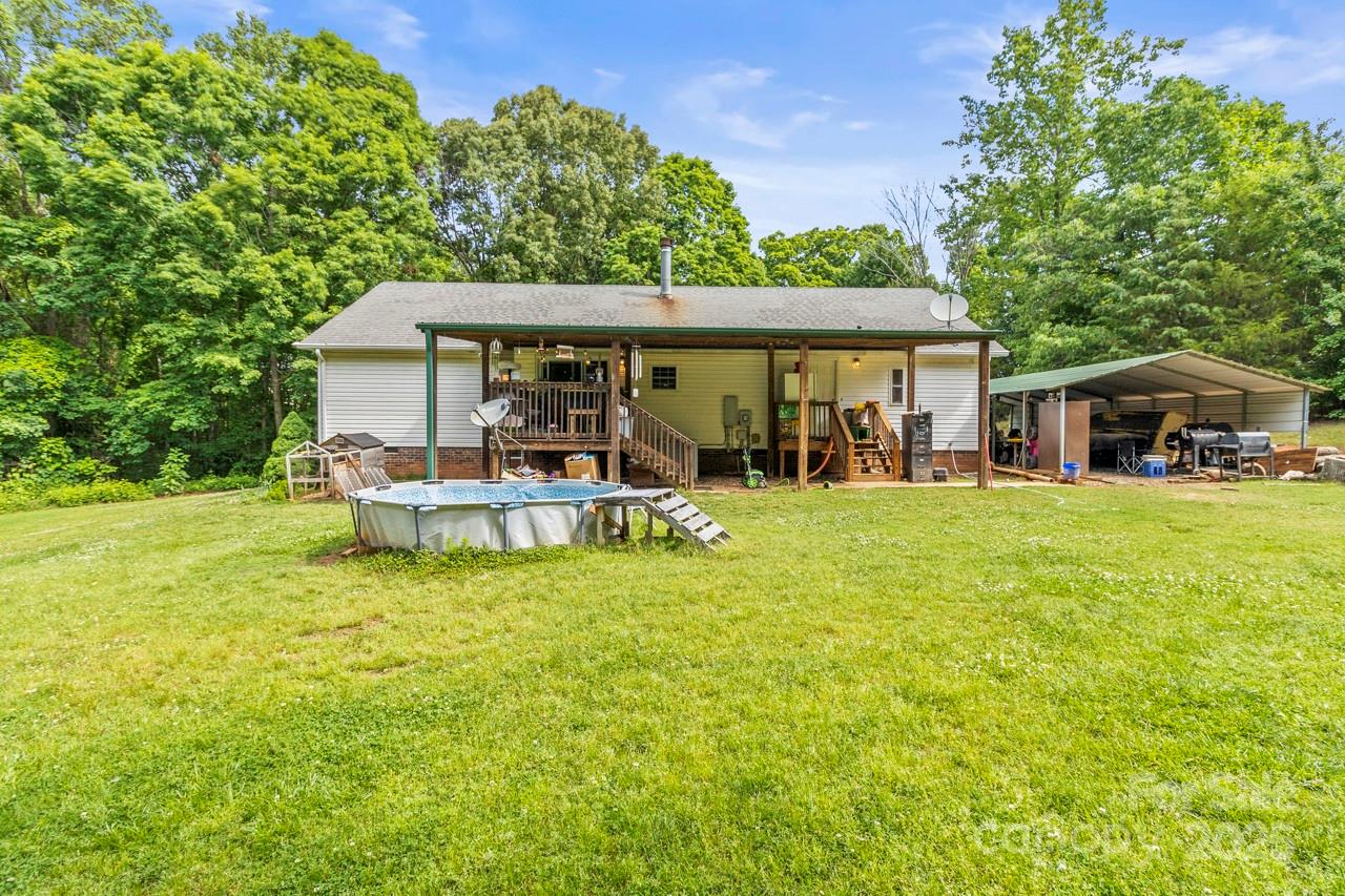 4155 Slanting Bridge Road Sherrills Ford, NC 28673 - Photo 3 of 34 a backyard of a house with table and chairs