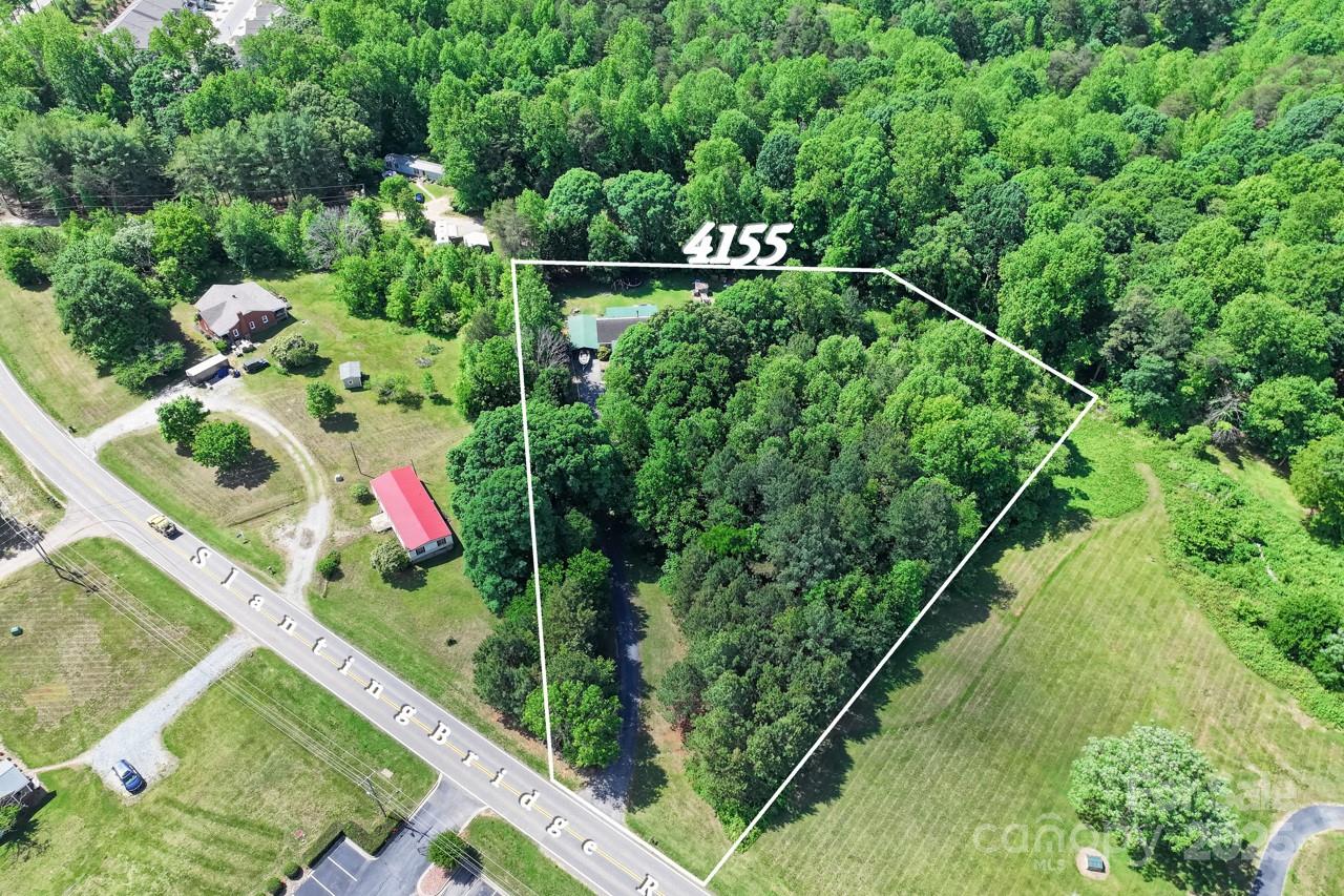 4155 Slanting Bridge Road Sherrills Ford, NC 28673 - Photo 33 of 34 a view of a sign in a garden