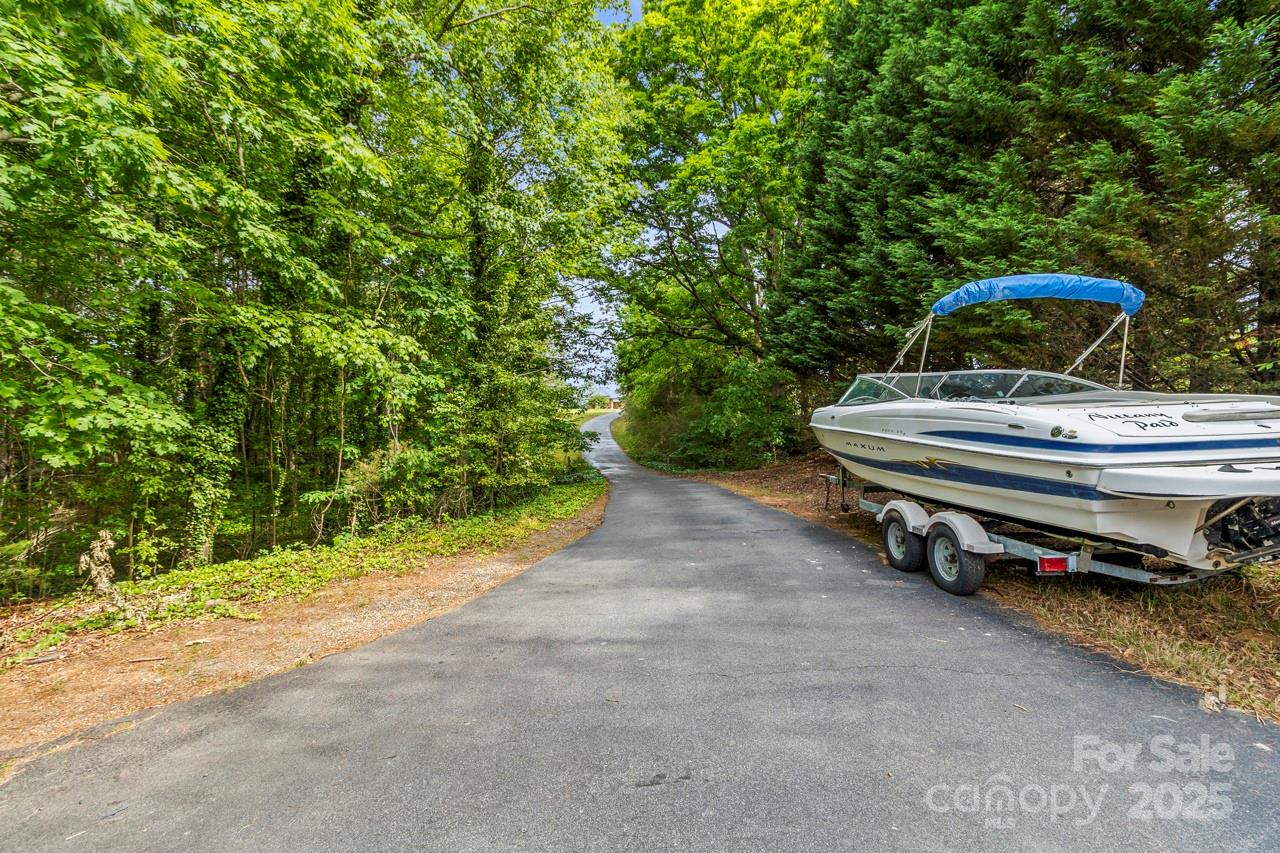 4155 Slanting Bridge Road Sherrills Ford, NC 28673 - Photo 7 of 34 a view of a yard with plants and a small yard