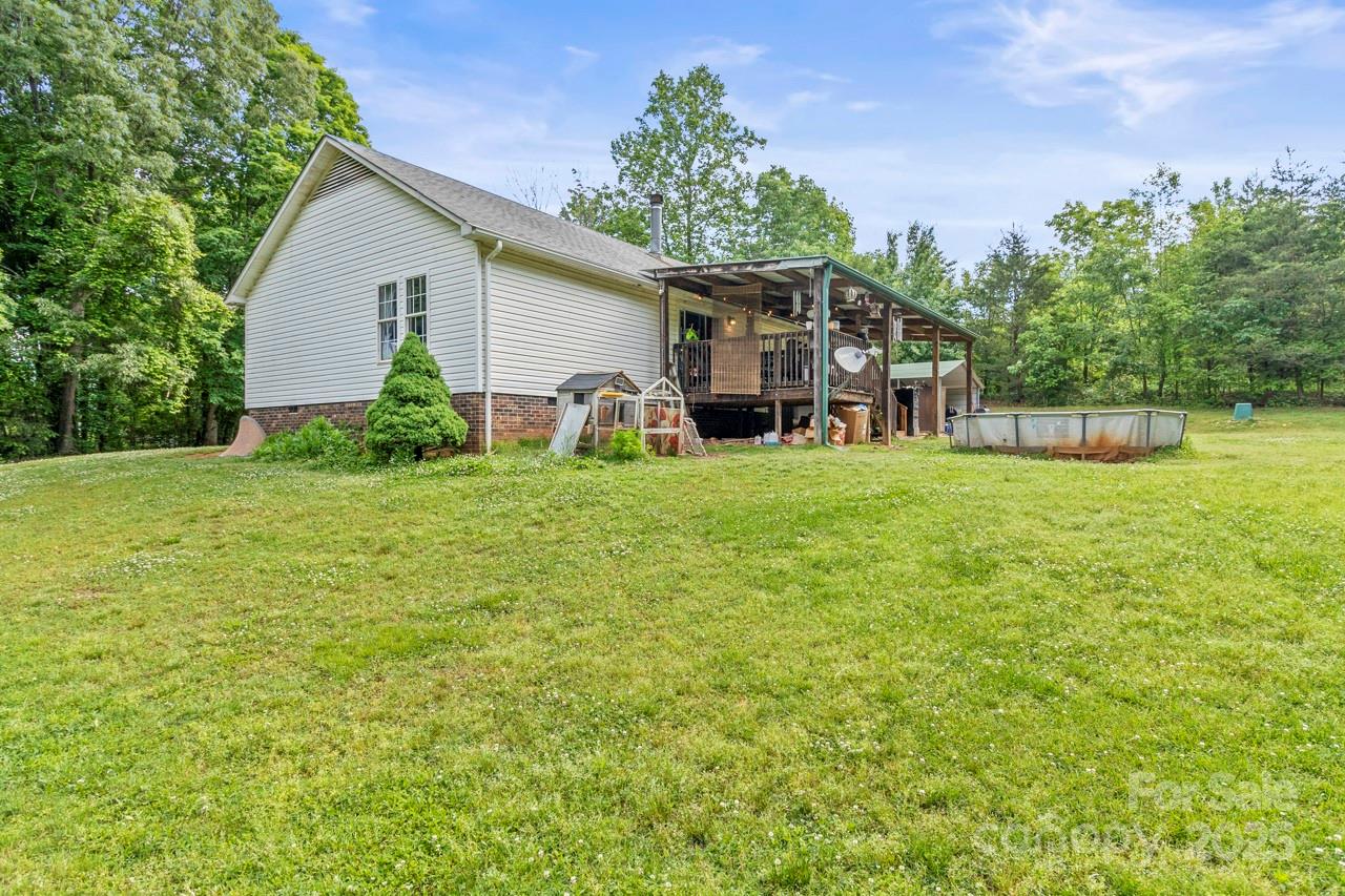 4155 Slanting Bridge Road Sherrills Ford, NC 28673 - Photo 9 of 34 a view of a house with a yard and sitting area