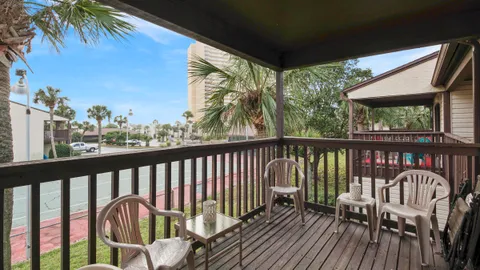 a view of a two chairs in the balcony