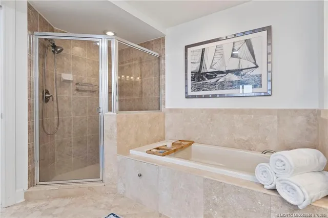 a bathroom with a bathtub and shower
