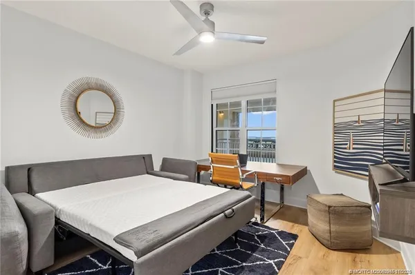 a bedroom with a bed and a table