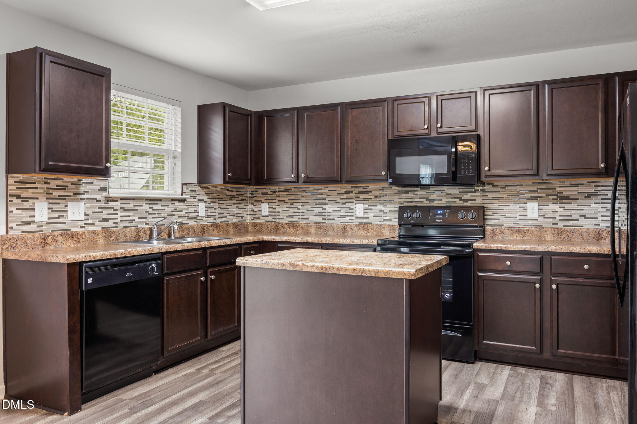 45 Crane Way Bunnlevel, NC 28323 - Photo 14 of 35 a kitchen with kitchen island granite countertop wooden cabinets stainless steel appliances and a sink