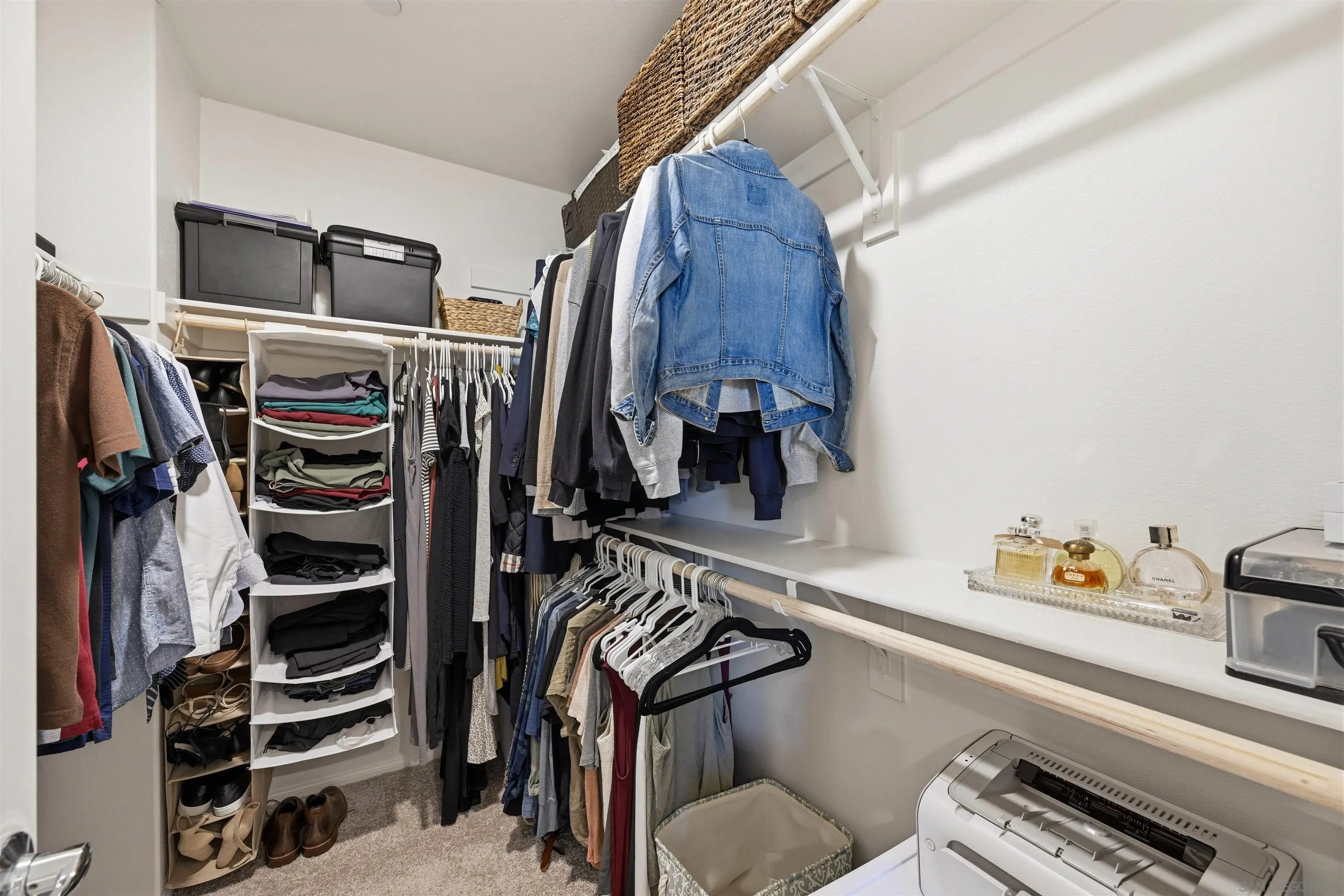 5616 Daybreak Way Bonsall, CA 92003 - Photo 12 of 24 a view of walk in closet with clothes and shoes