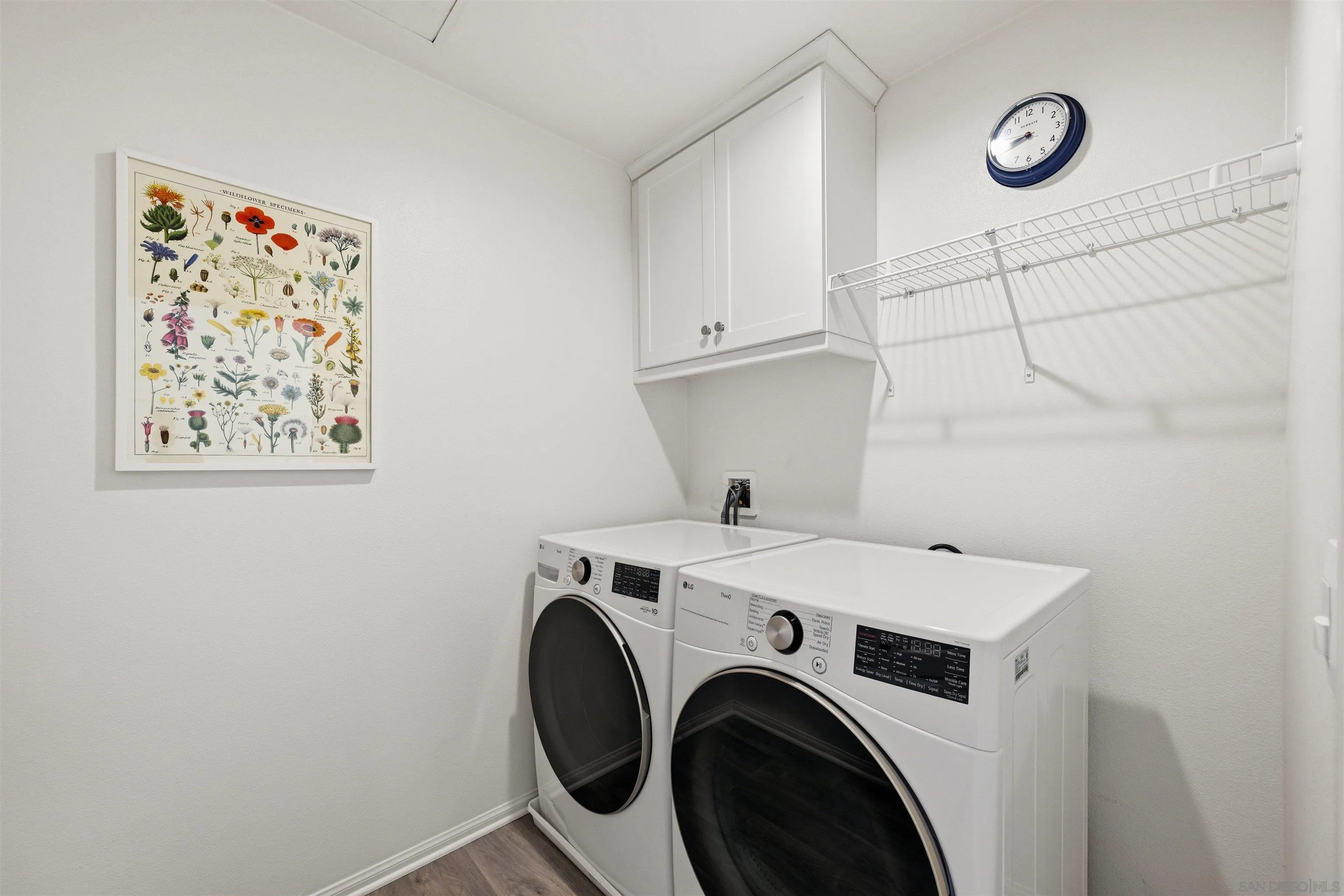 5616 Daybreak Way Bonsall, CA 92003 - Photo 17 of 24 a view of storage and utility room with washer and dryer