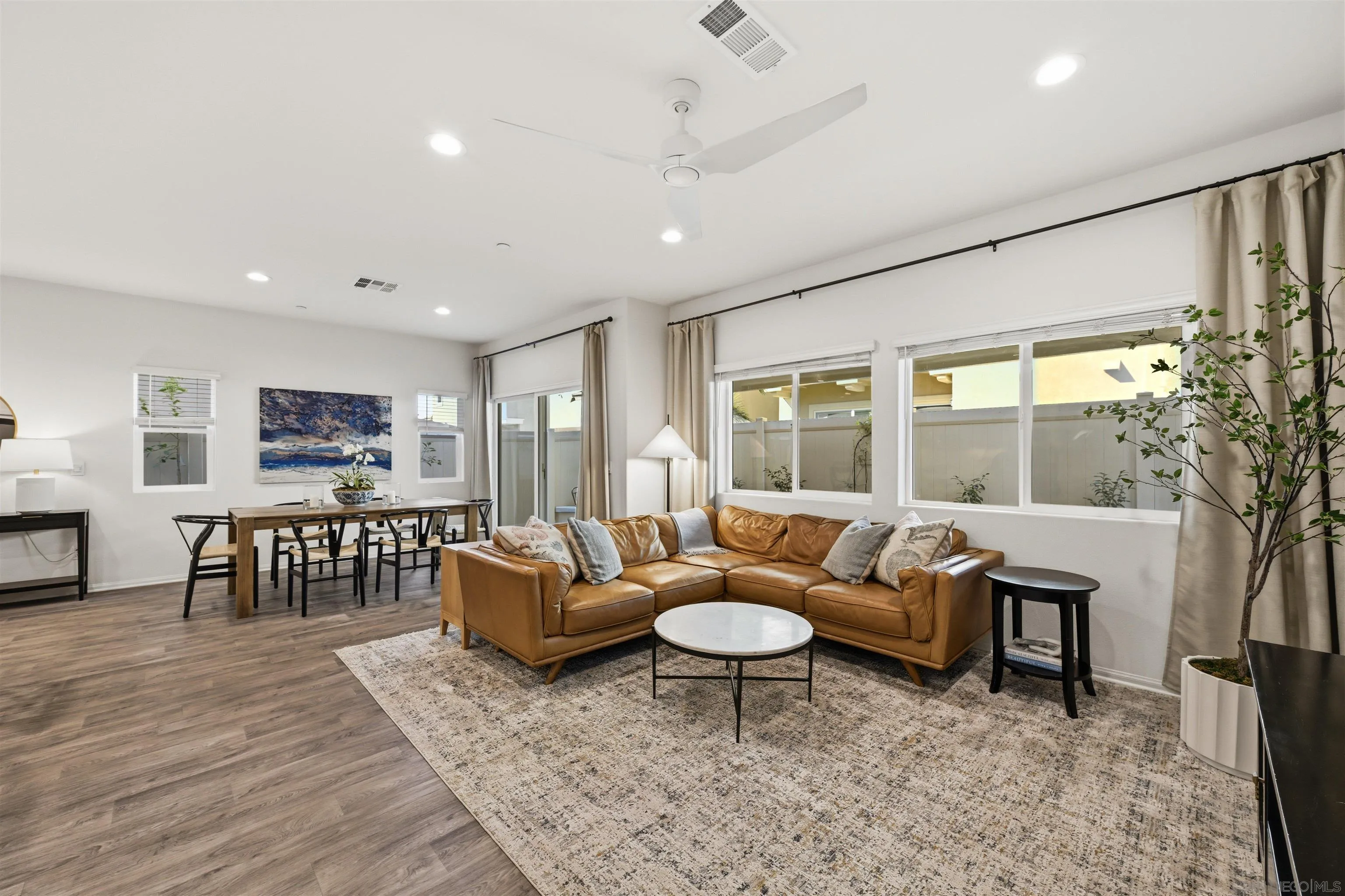 5616 Daybreak Way Bonsall, CA 92003 - Photo 3 of 24 a living room with furniture a rug and a large window
