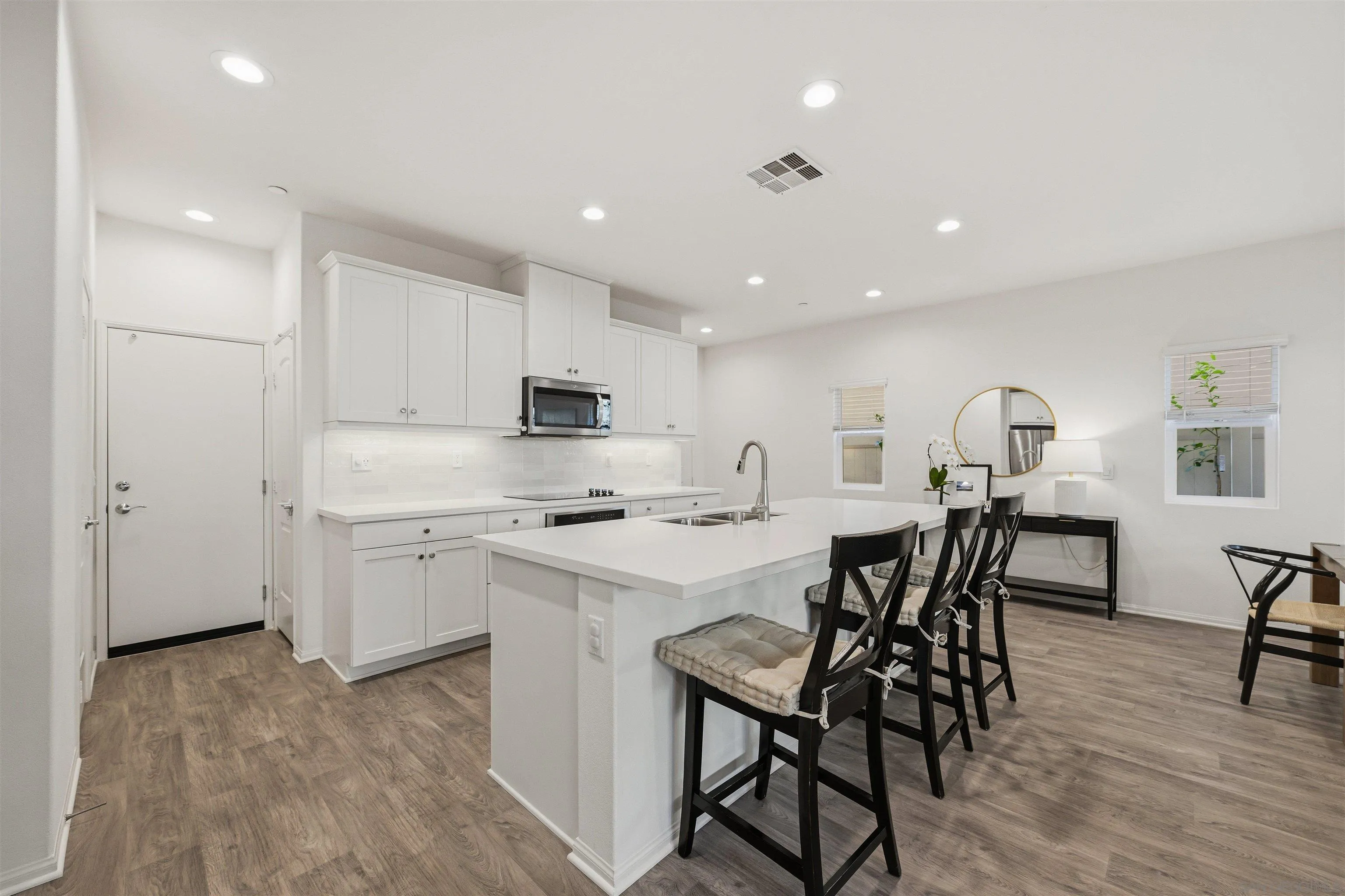 5616 Daybreak Way Bonsall, CA 92003 - Photo 5 of 24 a view of kitchen with cabinets table and chairs