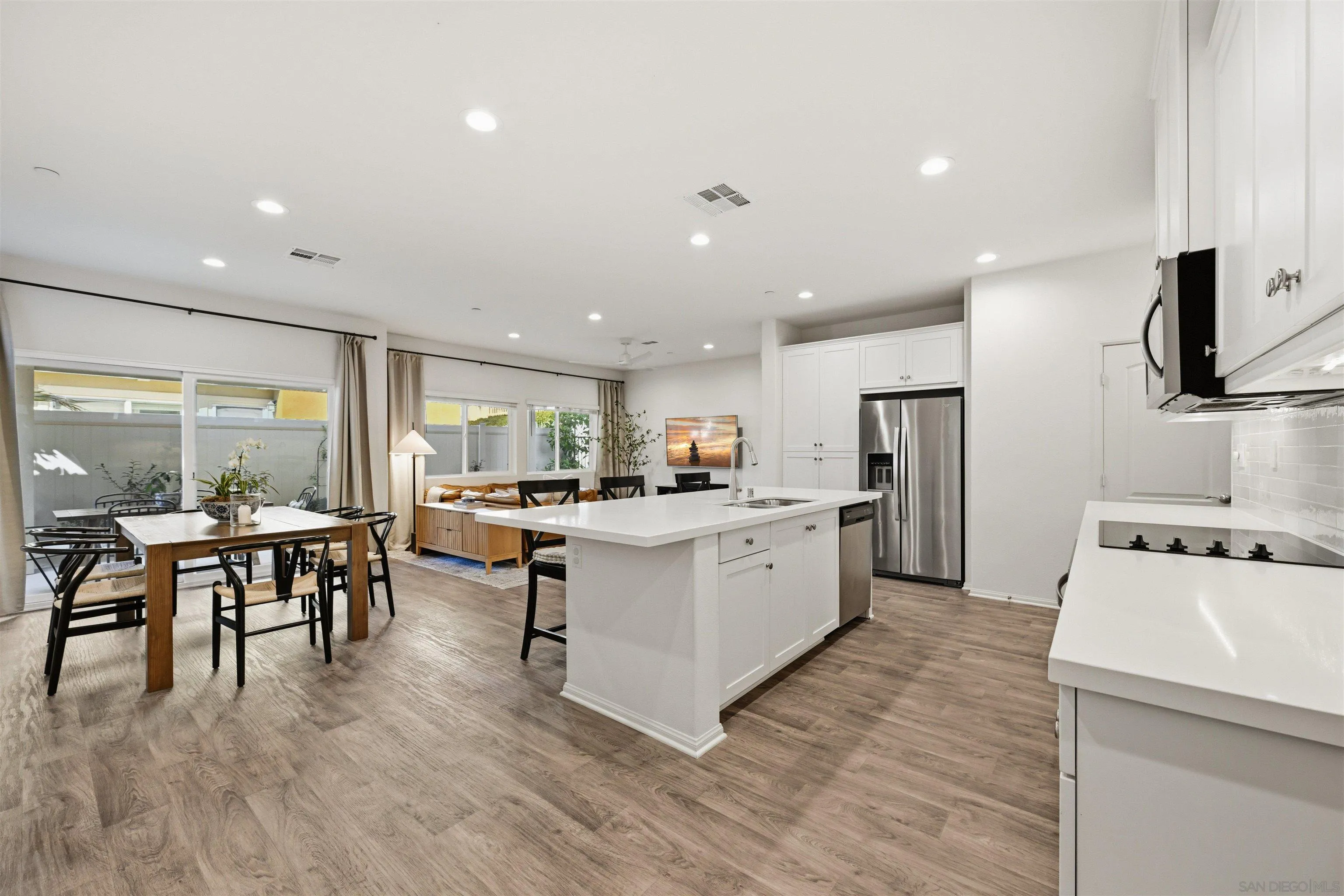 5616 Daybreak Way Bonsall, CA 92003 - Photo 6 of 24 a kitchen with a sink a counter top space and stainless steel appliances
