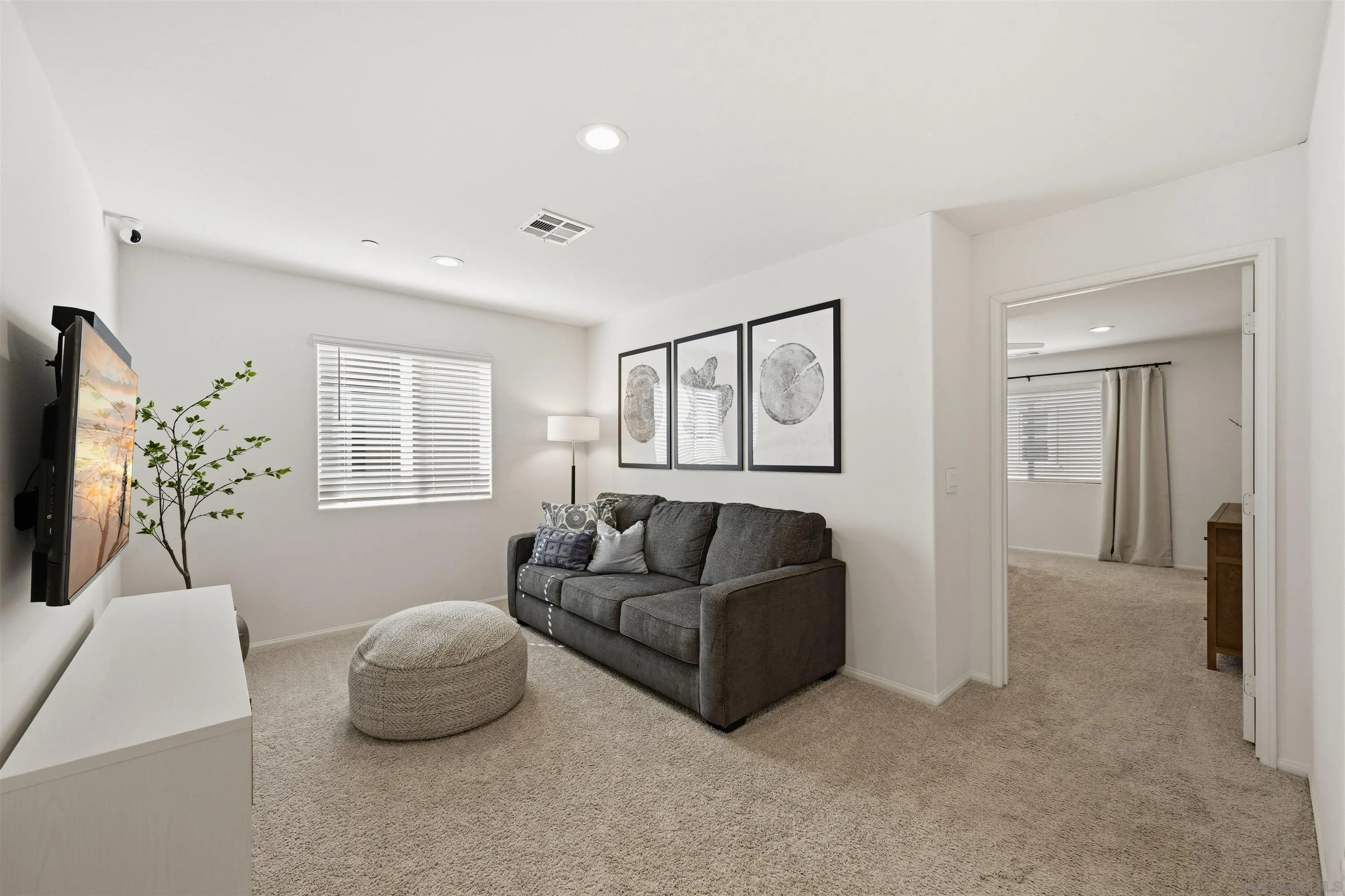 5616 Daybreak Way Bonsall, CA 92003 - Photo 8 of 24 a living room with furniture and a window