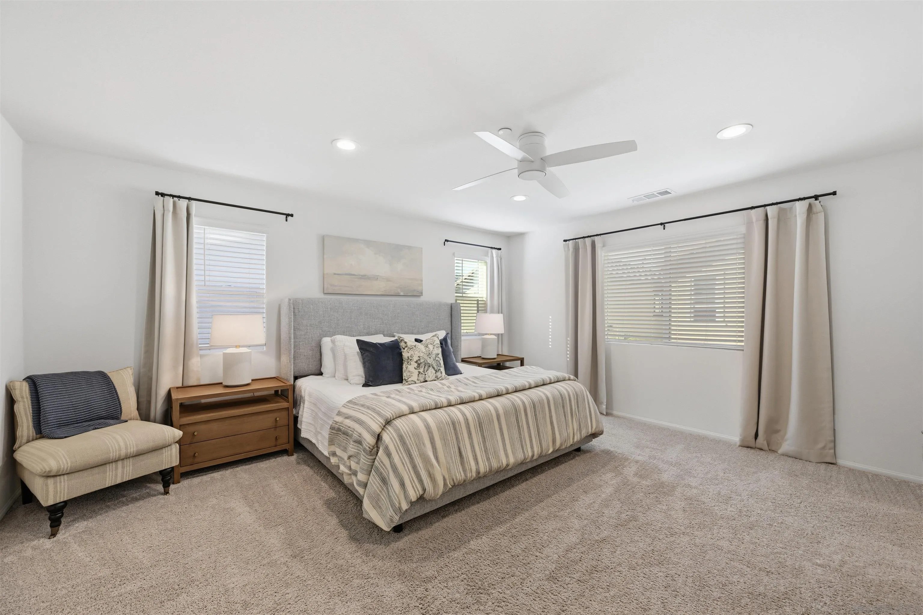 5616 Daybreak Way Bonsall, CA 92003 - Photo 9 of 24 a bedroom with a bed rug and couch
