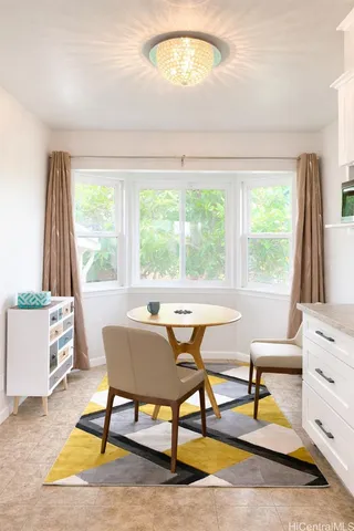 a view of a room with gym equipment and a window