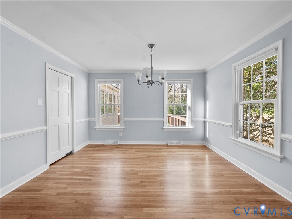 1330 Winslow Road Richmond, VA 23235 - Photo 15 of 46 a view of an empty room with wooden floor and a window
