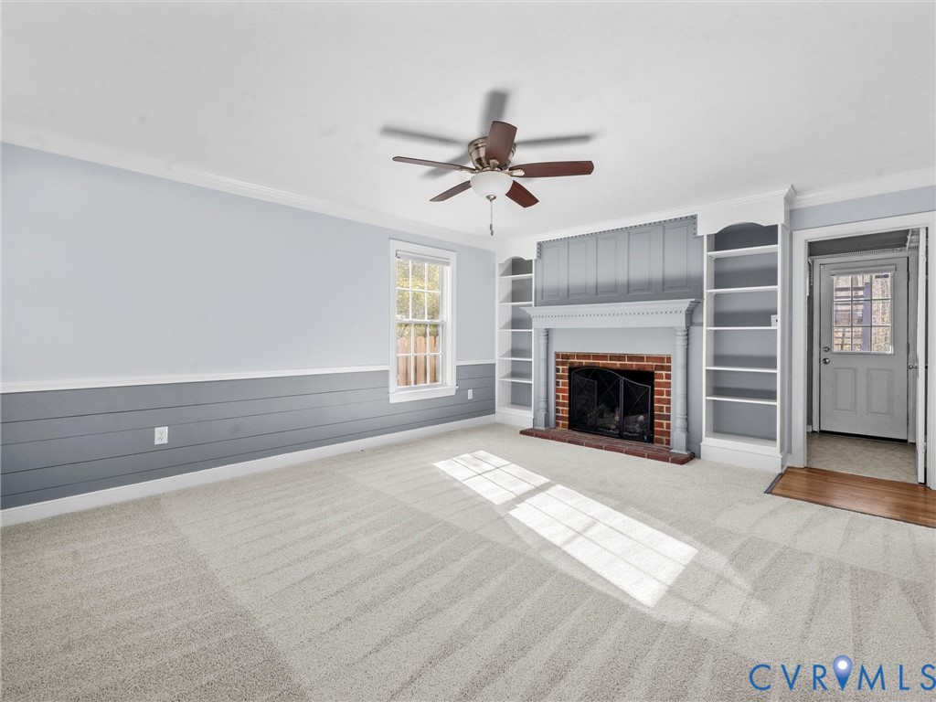 1330 Winslow Road Richmond, VA 23235 - Photo 25 of 46 a view of a livingroom with a fireplace and window