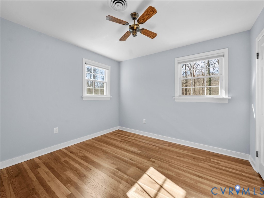 1330 Winslow Road Richmond, VA 23235 - Photo 27 of 46 a view of empty room with wooden floor and fan