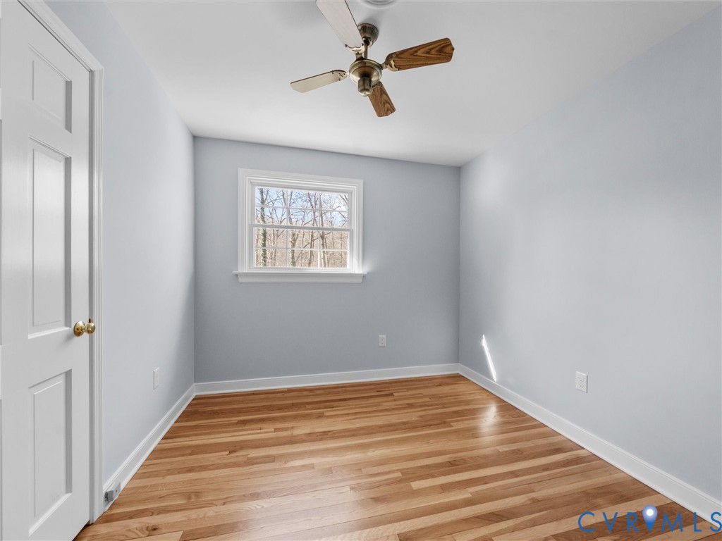 1330 Winslow Road Richmond, VA 23235 - Photo 28 of 46 an empty room with a window and a ceiling fan