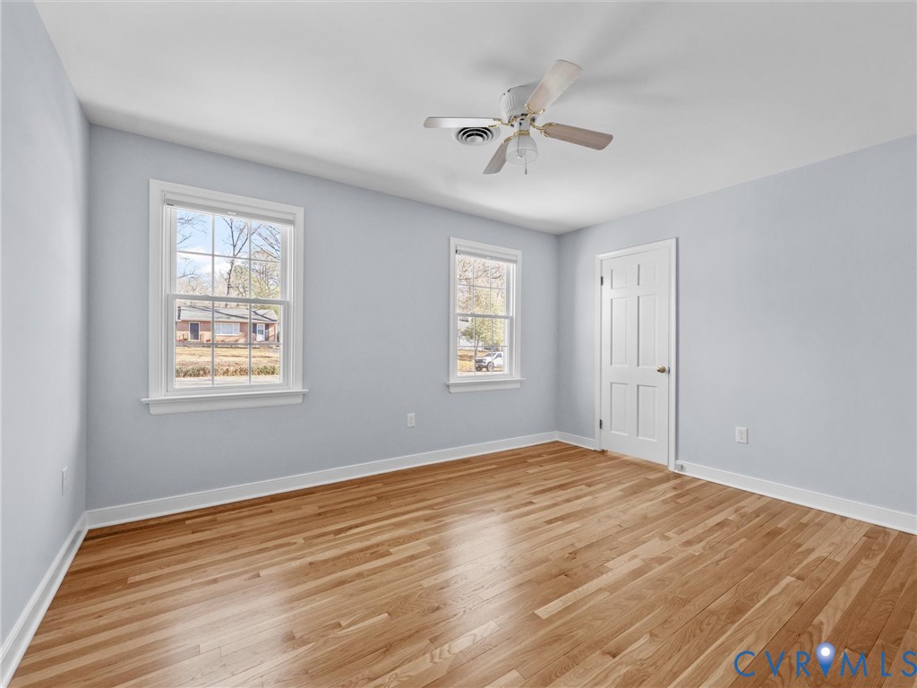 1330 Winslow Road Richmond, VA 23235 - Photo 29 of 46 a view of an empty room with wooden floor and a window