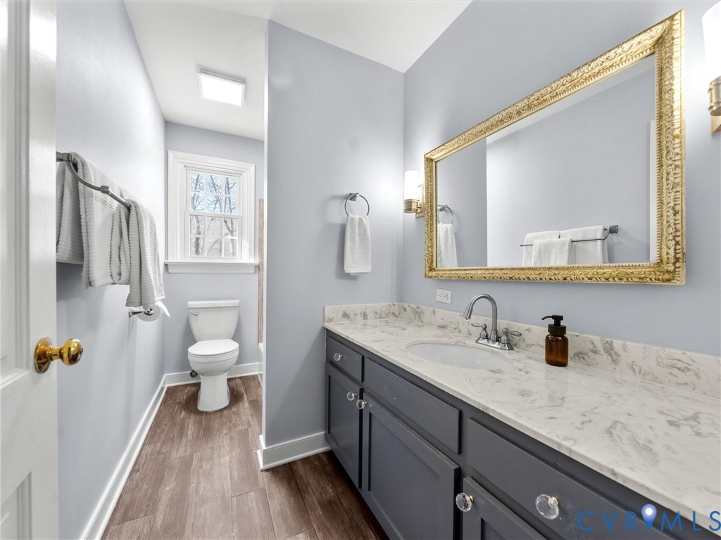 1330 Winslow Road Richmond, VA 23235 - Photo 31 of 46 a en suite bathroom with a granite countertop sink and a mirror