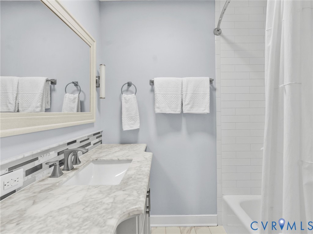 1330 Winslow Road Richmond, VA 23235 - Photo 35 of 46 a bathroom with a granite countertop sink and a mirror