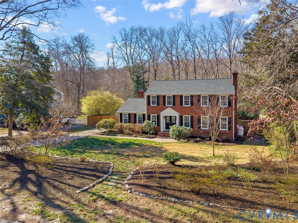 1330 Winslow Road Richmond, VA 23235 - Photo 4 of 46 a view of a house with a yard covered with snow in the yard