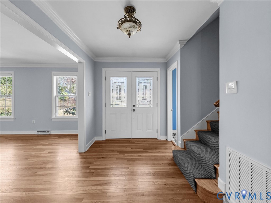 1330 Winslow Road Richmond, VA 23235 - Photo 8 of 46 a view of an entryway with wooden floor and staircase