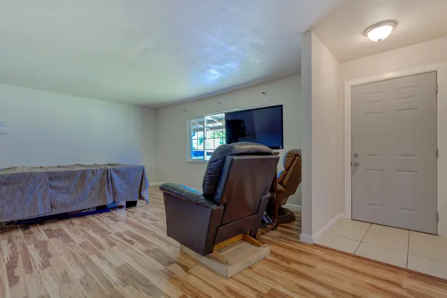 a room with furniture and wooden floor