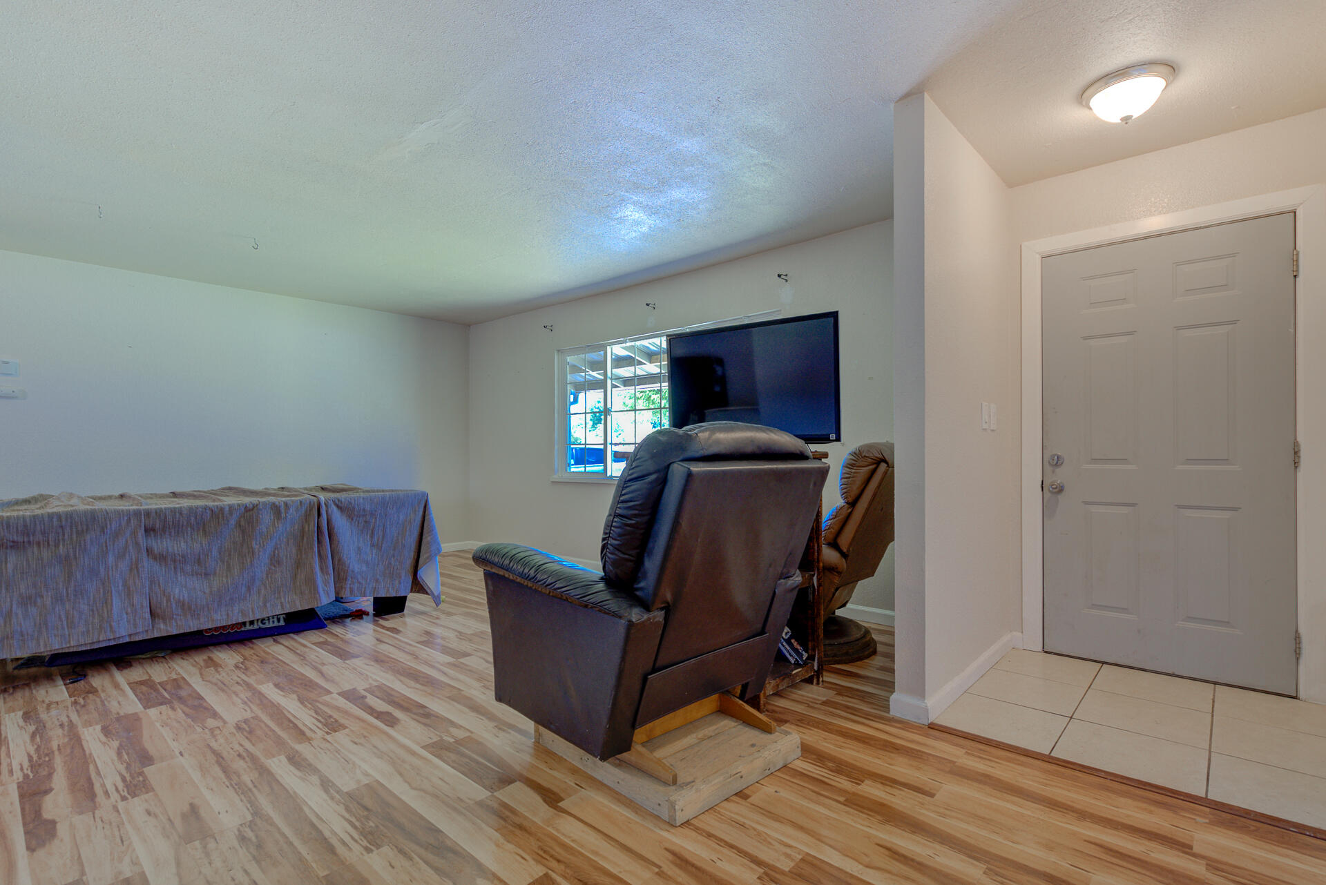 37153-55 Siskiyou Street Burney, CA 96013 - Photo 20 of 32 a room with furniture and wooden floor