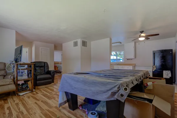 a bed room with furniture and a chandelier