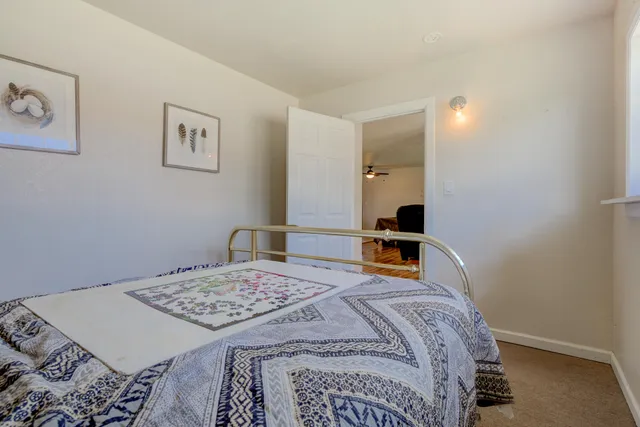 a bedroom with a bed and a table in it