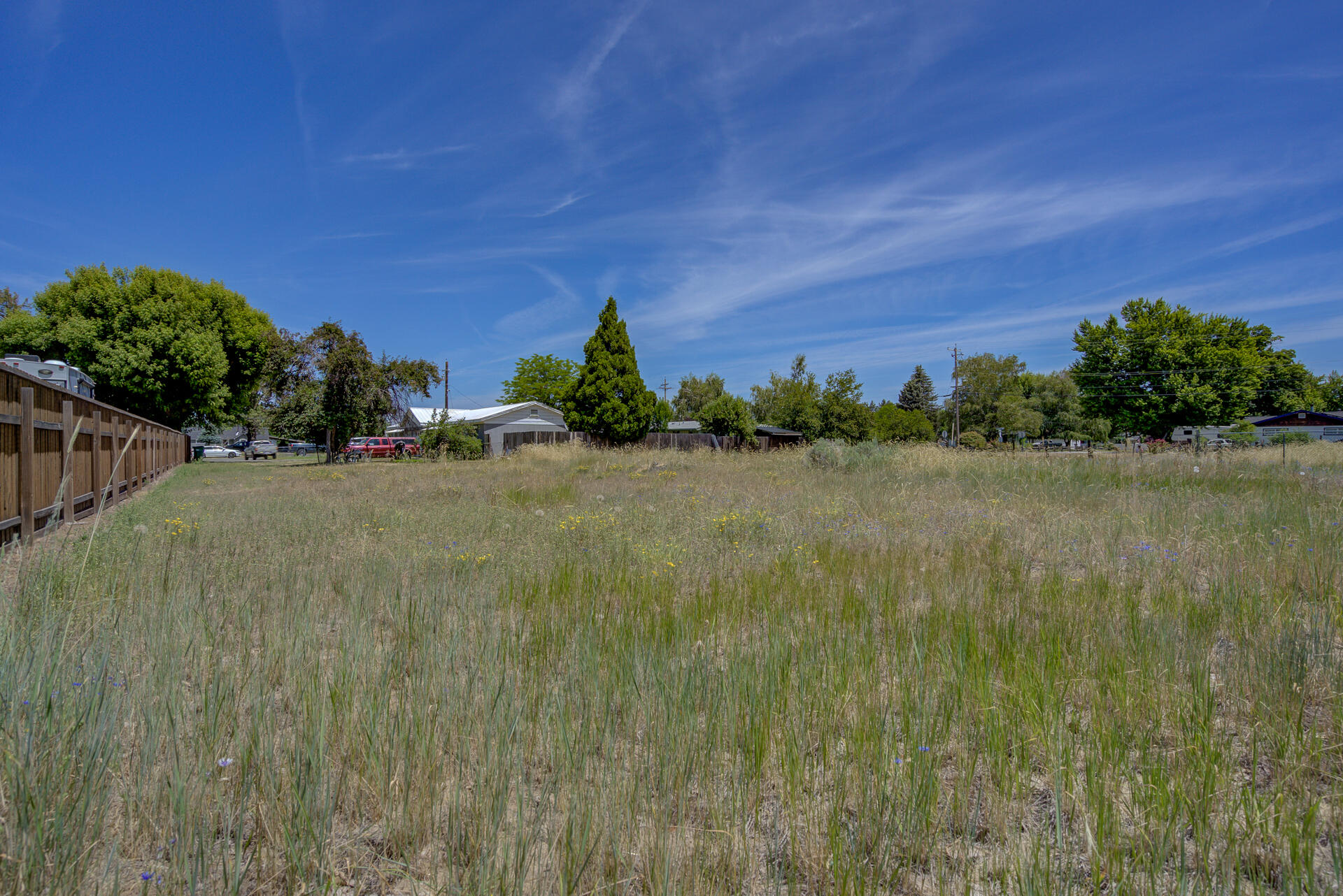 37153-55 Siskiyou Street Burney, CA 96013 - Photo 3 of 32 a view of a garden with a building in the background