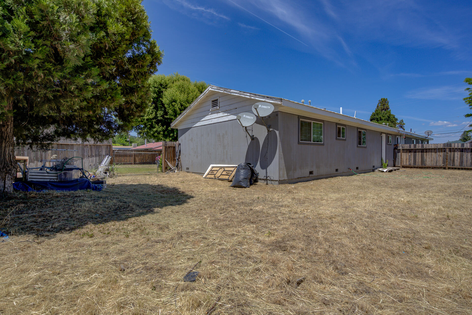 37153-55 Siskiyou Street Burney, CA 96013 - Photo 5 of 32 a view of a barn in the backyard of a house