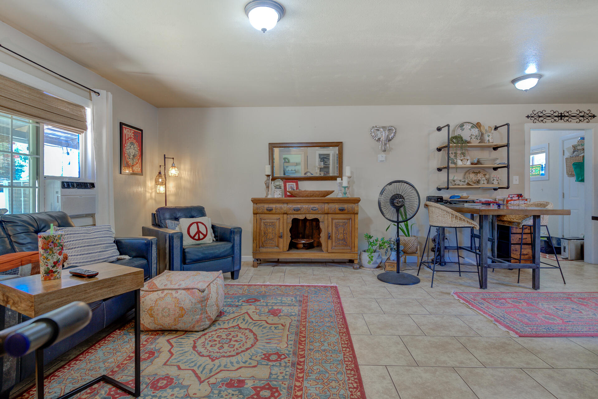 37153-55 Siskiyou Street Burney, CA 96013 - Photo 7 of 32 a living room with furniture a clock and a fireplace
