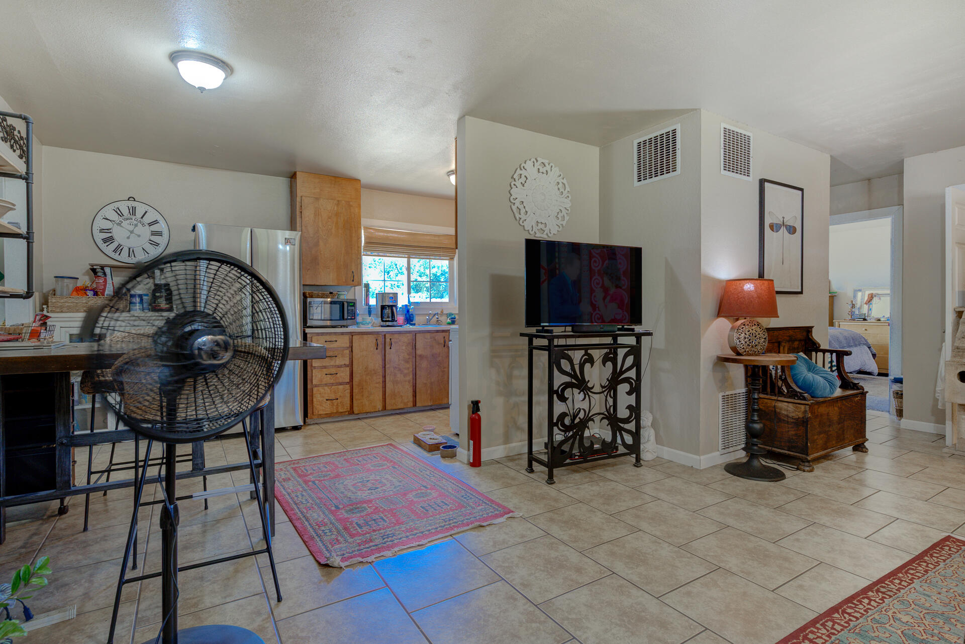 37153-55 Siskiyou Street Burney, CA 96013 - Photo 8 of 32 a living room with furniture a flat screen tv and a refrigerator