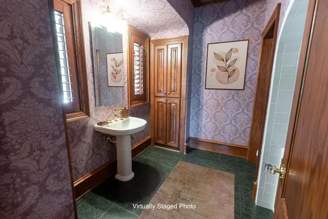 a bathroom with a sink and a mirror