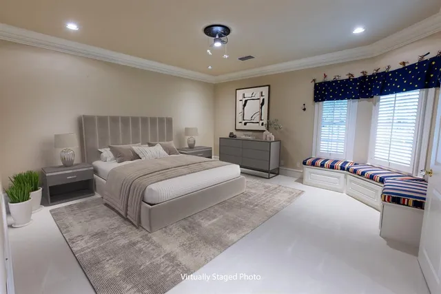 a bedroom with a bed and a couch