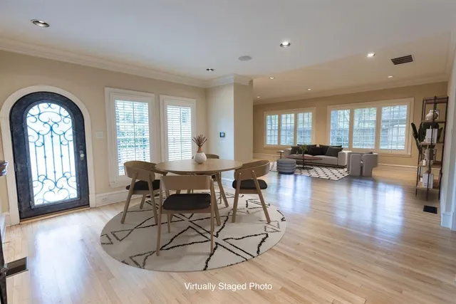 a view of a livingroom with furniture window and wooden floor