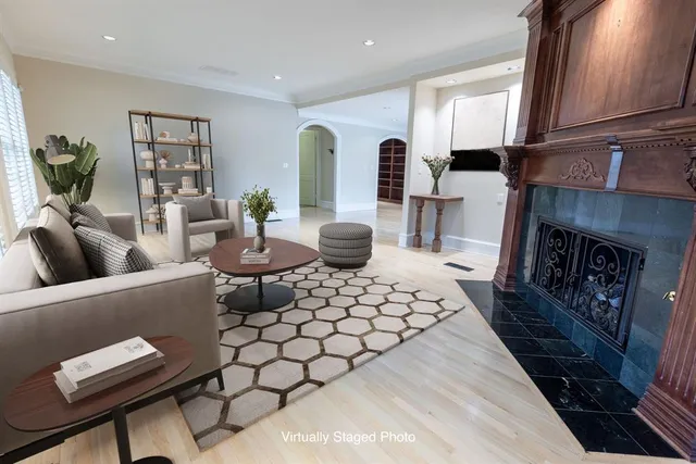 a living room with furniture and a fireplace