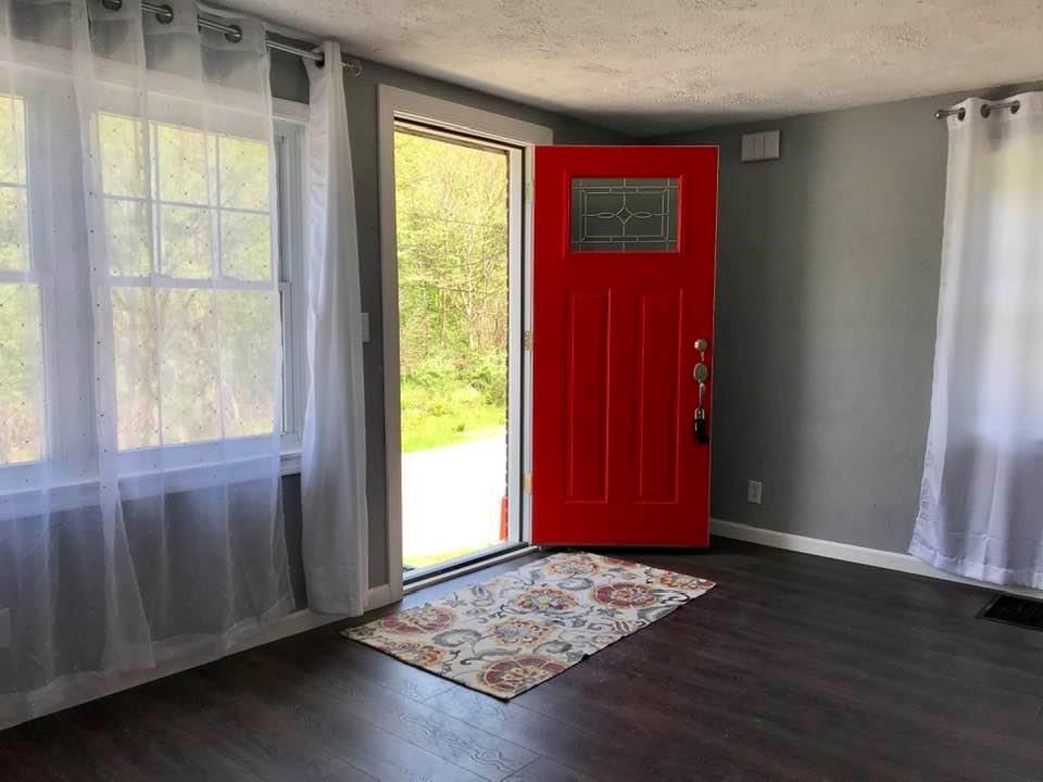 441 Agnew Road Jeannette, PA 15644 - Photo 3 of 25 Come on in and visit...lovely lightfilled living room with new exterior door, new laminate flooring freshly painted