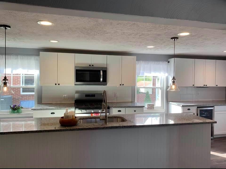 441 Agnew Road Jeannette, PA 15644 - Photo 6 of 25 wall of new white cabinetry with dark pulls , has room for everything, all stainless steel appliances and gas stove stay