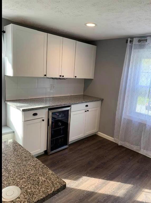 441 Agnew Road Jeannette, PA 15644 - Photo 9 of 25 wine and coffee bar area with wine fridge and undercabinet wine glass holders