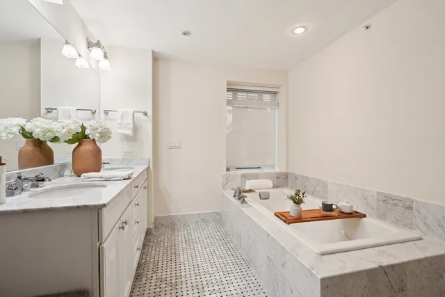 a view of a kitchen with a sink and living room