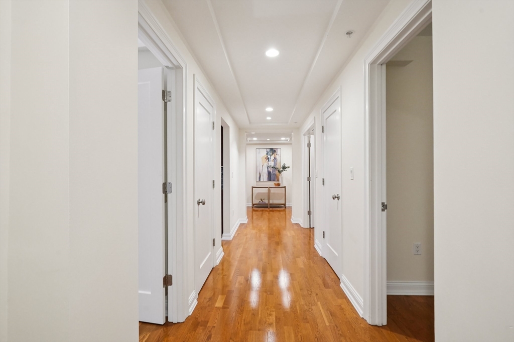20 Chapel Street, Unit B811 Brookline, MA 02446 - Photo 6 of 32 a view of a hallway with wooden floor