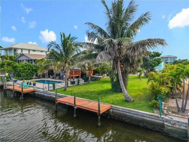 a view of yard with swimming pool and outdoor seating
