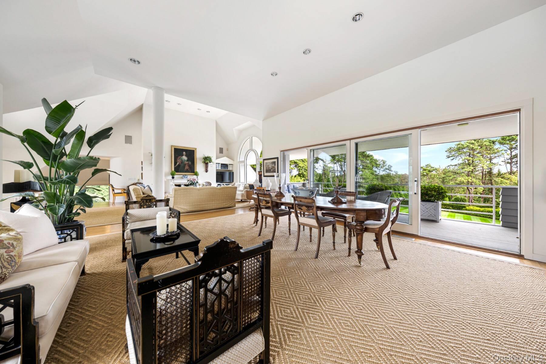 20 Hillside Road Southampton, NY 11968 - Photo 12 of 32 a living room with furniture a large window and a table