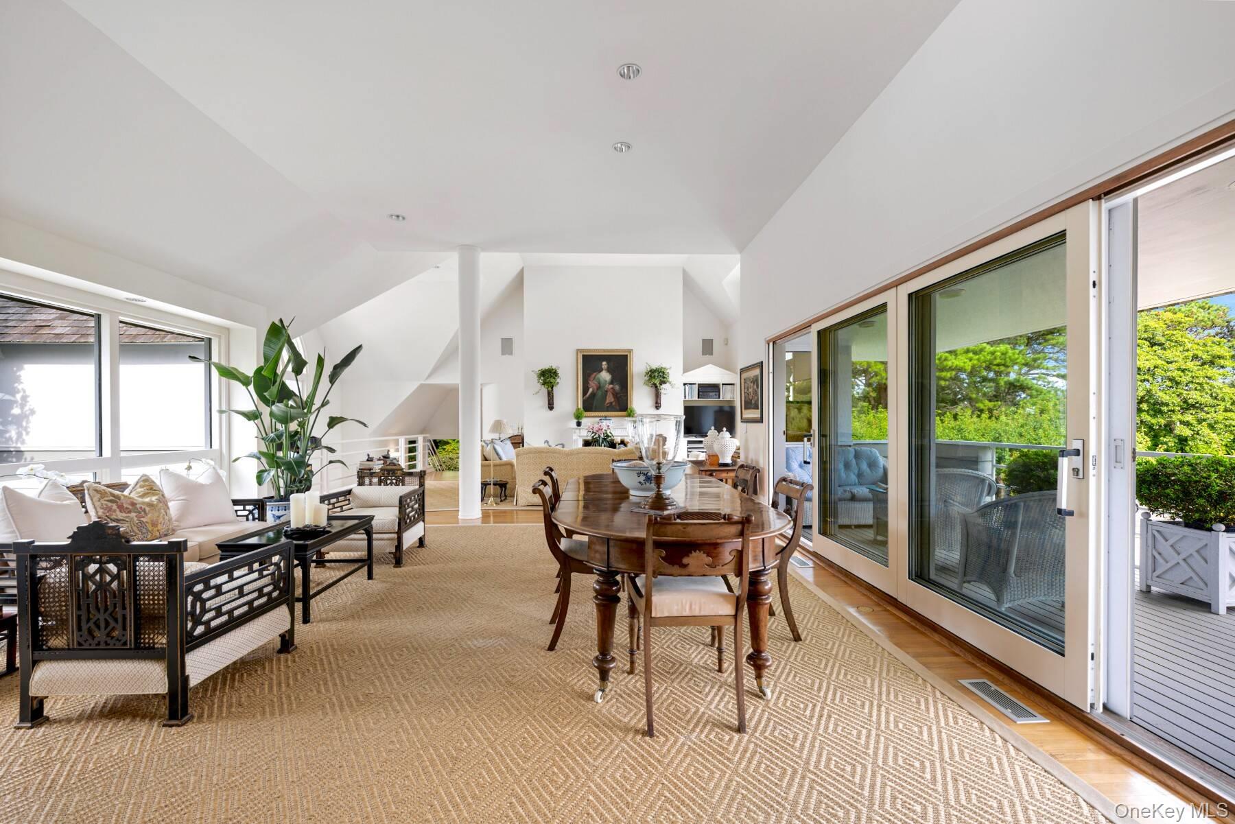 20 Hillside Road Southampton, NY 11968 - Photo 13 of 32 a living room with furniture and large windows