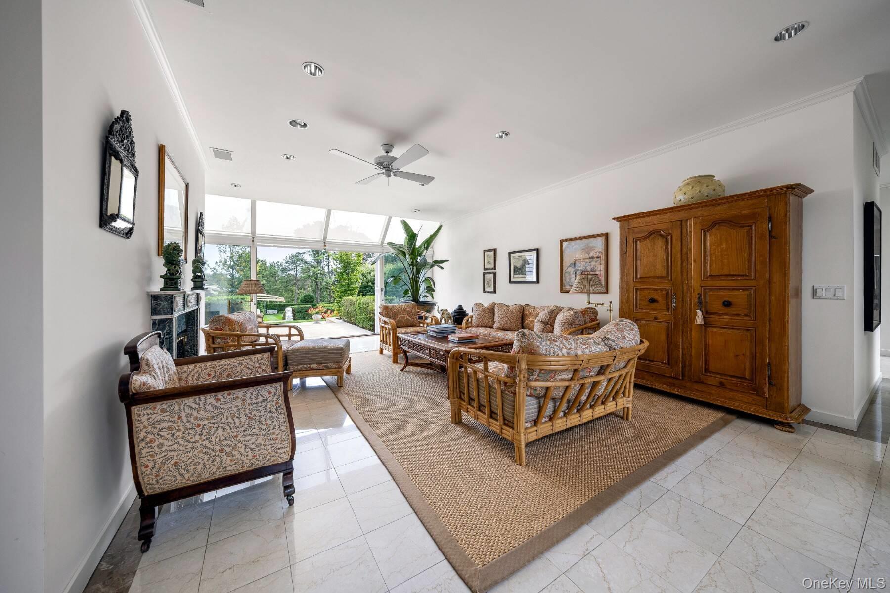 20 Hillside Road Southampton, NY 11968 - Photo 25 of 32 a living room with furniture and a large window
