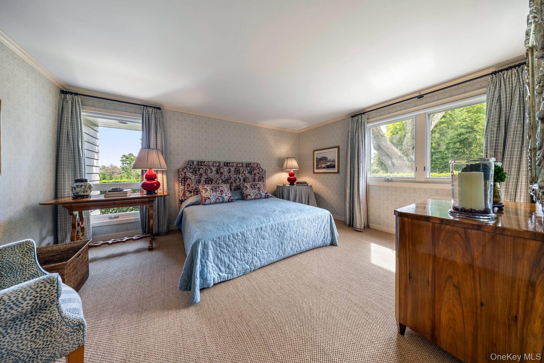 20 Hillside Road Southampton, NY 11968 - Photo 26 of 32 a bedroom with a bed and large windows